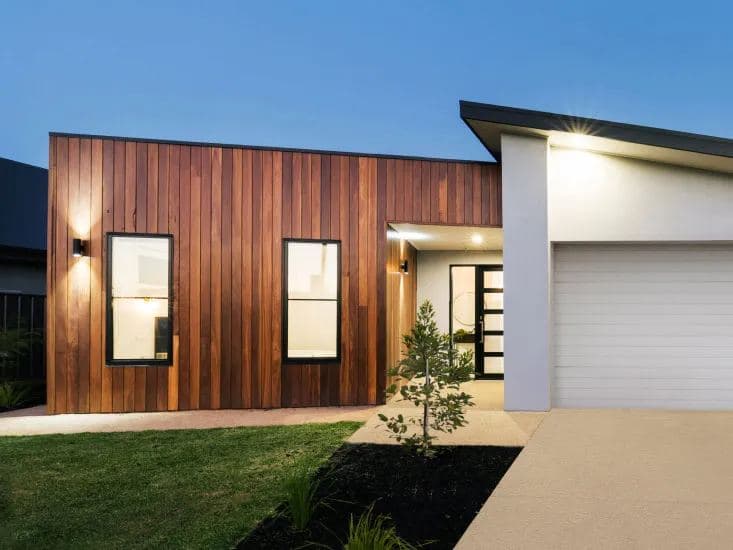 A home with new exterior lighting at dusk